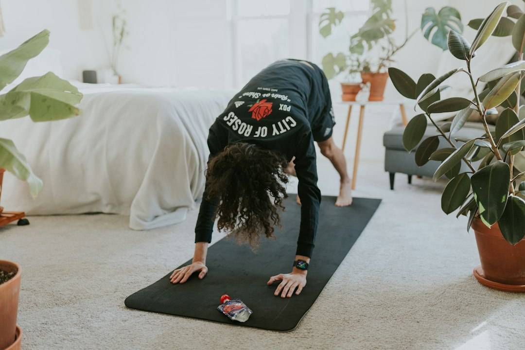 Adult practising balance and mobility exercise at home