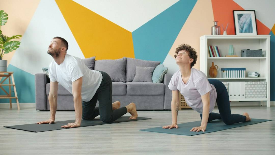 Adults practising a gentle mobility routine at home