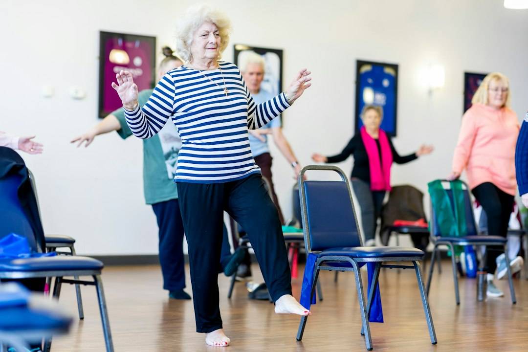 Older adults taking part in a gentle chair exercise class