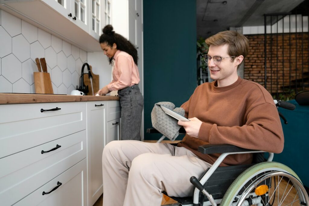 Wheelchair user at home representing disability-related living costs
