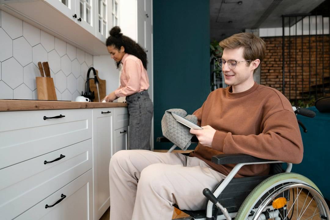 Wheelchair user at home representing disability-related living costs