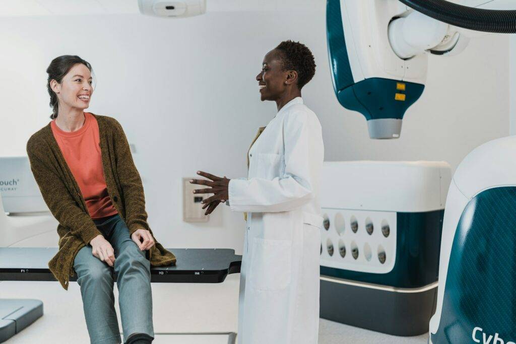 Doctor speaking with a patient in a medical consultation room