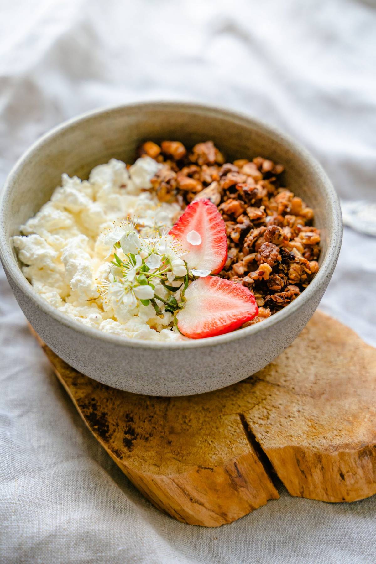Cottage cheese bowl with granola and strawberries