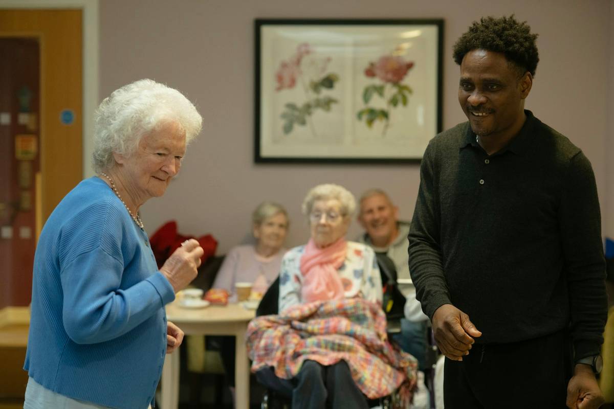 Older adults with a caregiver during a home support visit