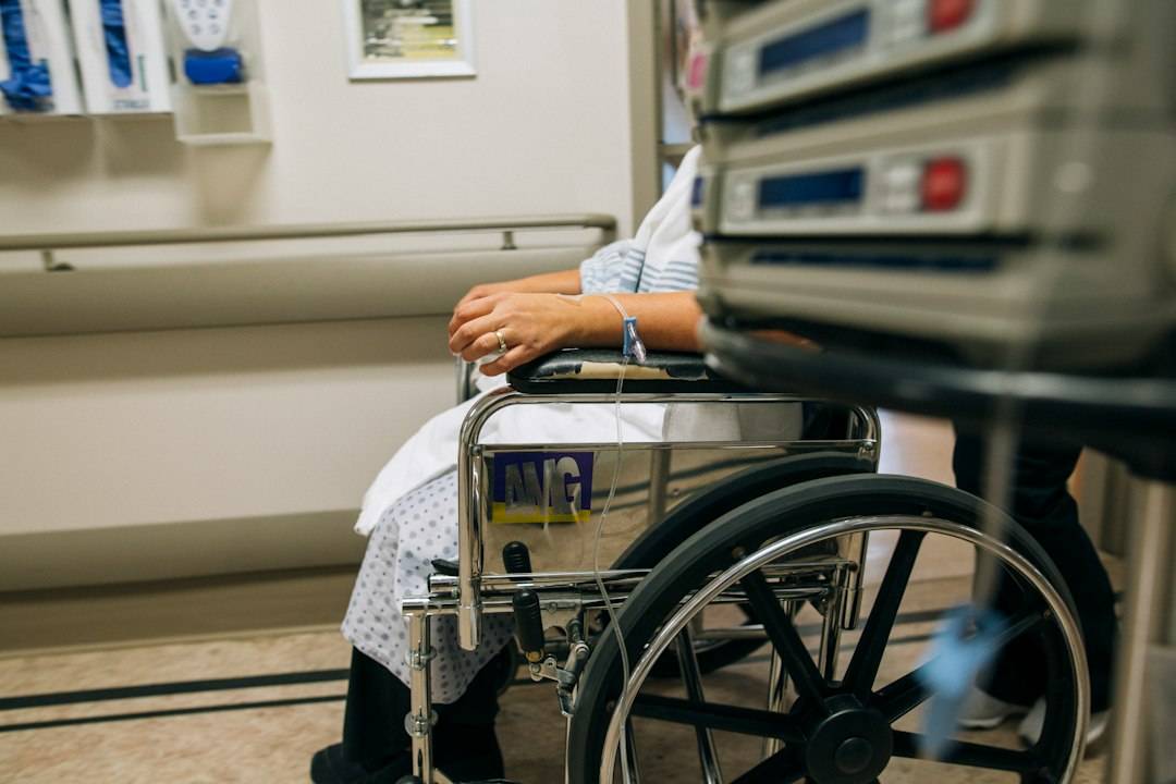 Older patient in a wheelchair in a hospital setting