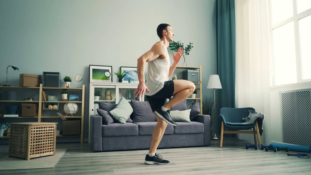 Adult moving actively in a living room during an indoor walking workout