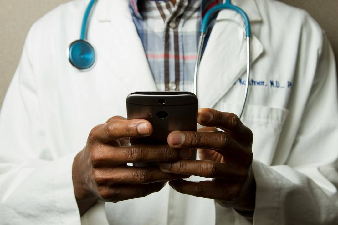 Healthcare professional using a smartphone for appointment communication
