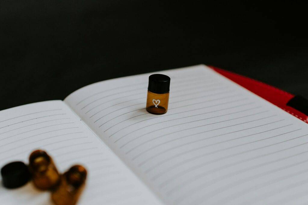 Medicine bottle resting on lined paper used for health notes