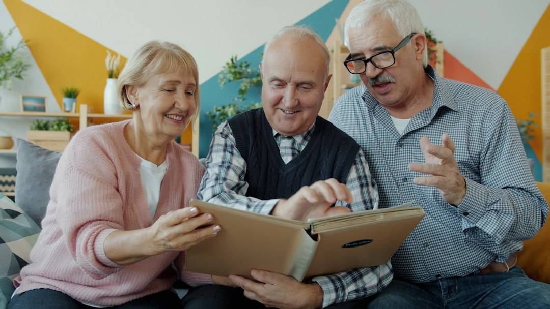Older adults sitting together at home during a care visit