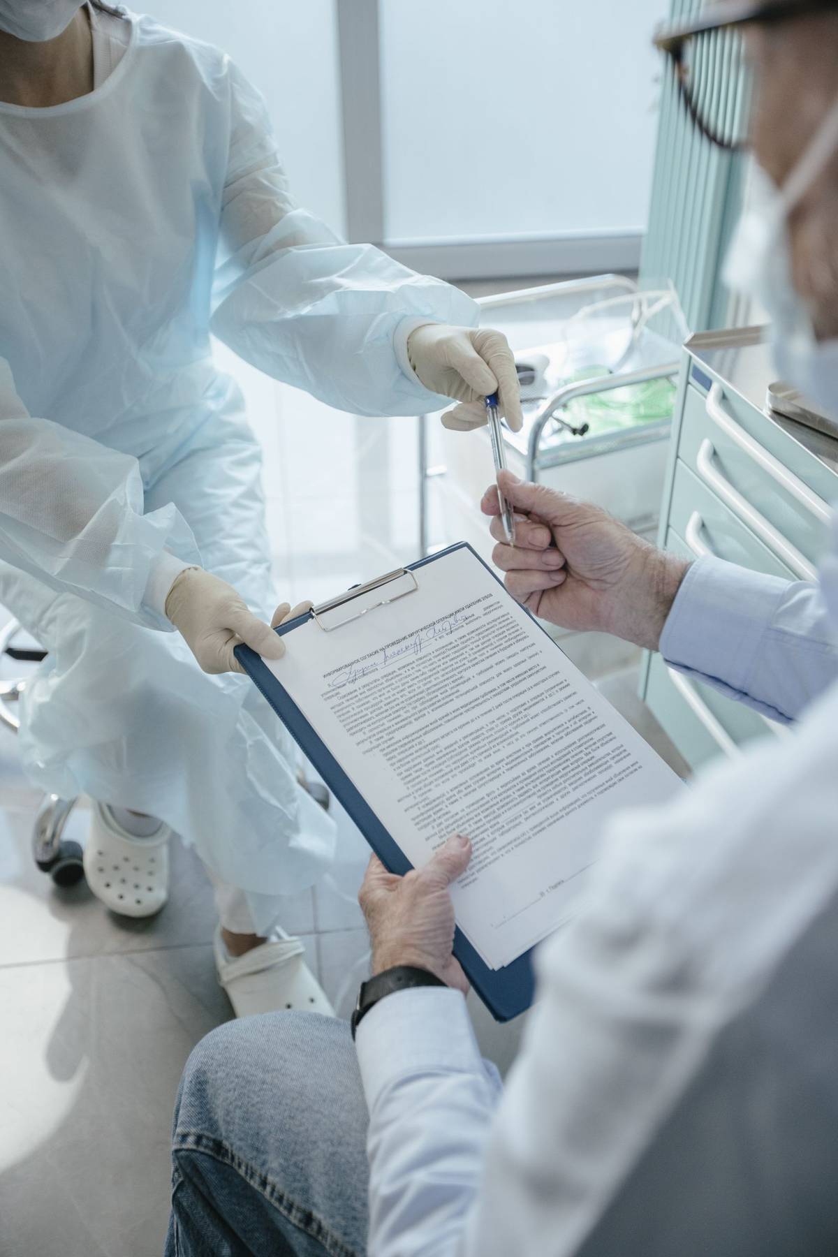 Doctor and patient reviewing referral paperwork during a consultation