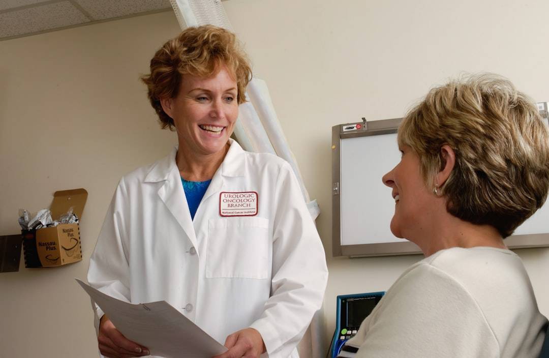 Doctor discussing referral priority and care with a patient