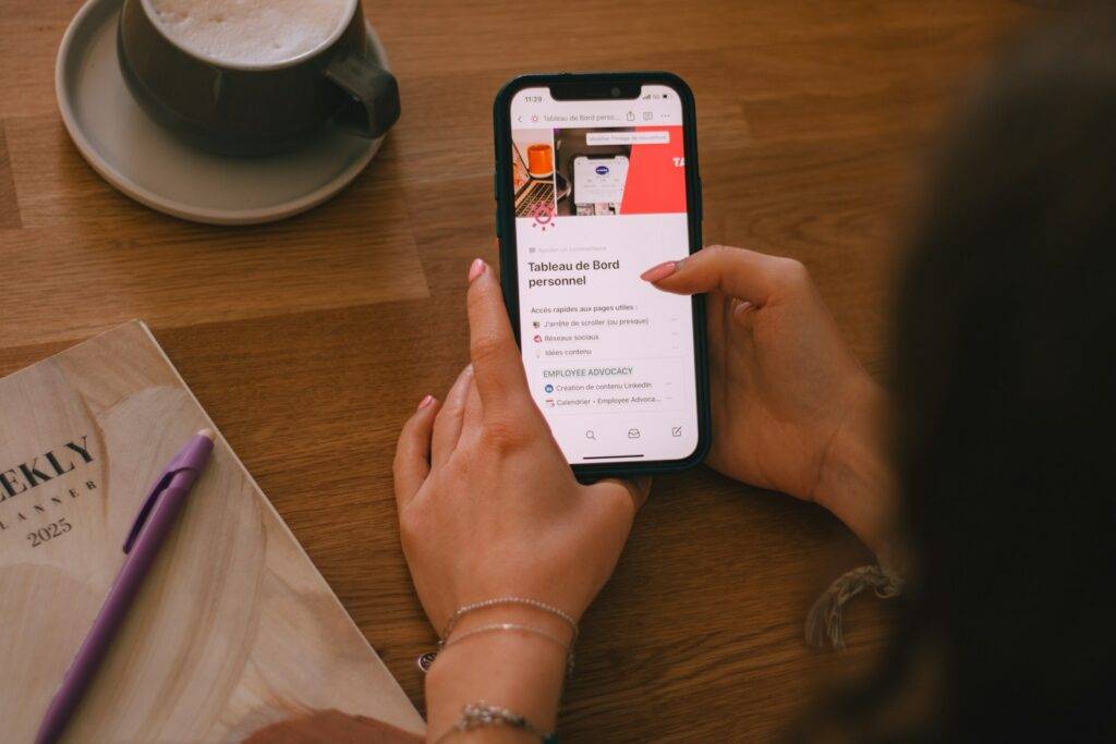 Person using a smartphone at home to manage follow-up information