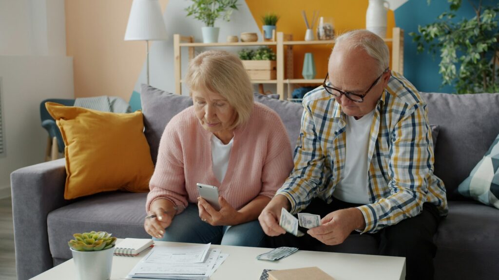 Older couple reviewing financial documents at home